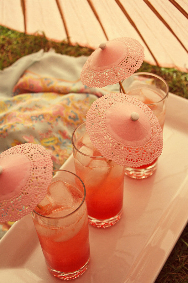 Pink paper doily parasols
