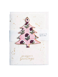 Decorative Christmas tree ornament on a greeting card with 'Season's Greetings' text.