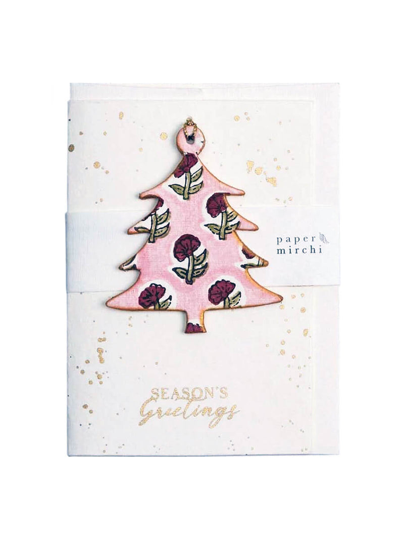 Decorative Christmas tree ornament on a greeting card with 'Season's Greetings' text.