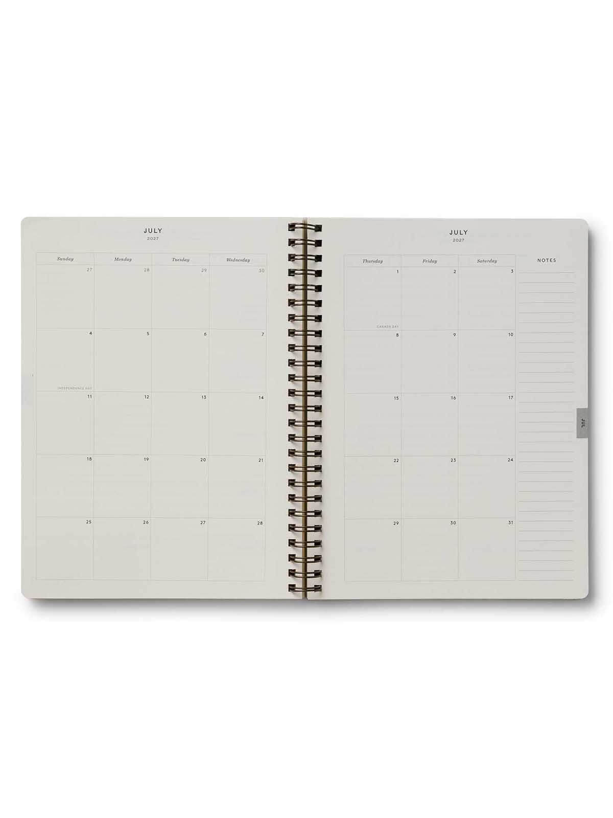Spiral-bound planner with a grid layout on a white background