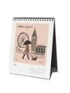 Calendar with illustration of a woman with an umbrella and dog near Big Ben and the London Eye.