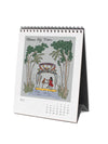 Desk calendar with illustration of palm trees and people on a lake, featuring the month of July.