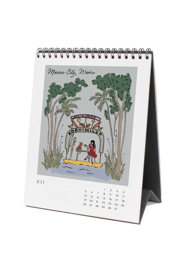 Desk calendar with illustration of palm trees and people on a lake, featuring the month of July.