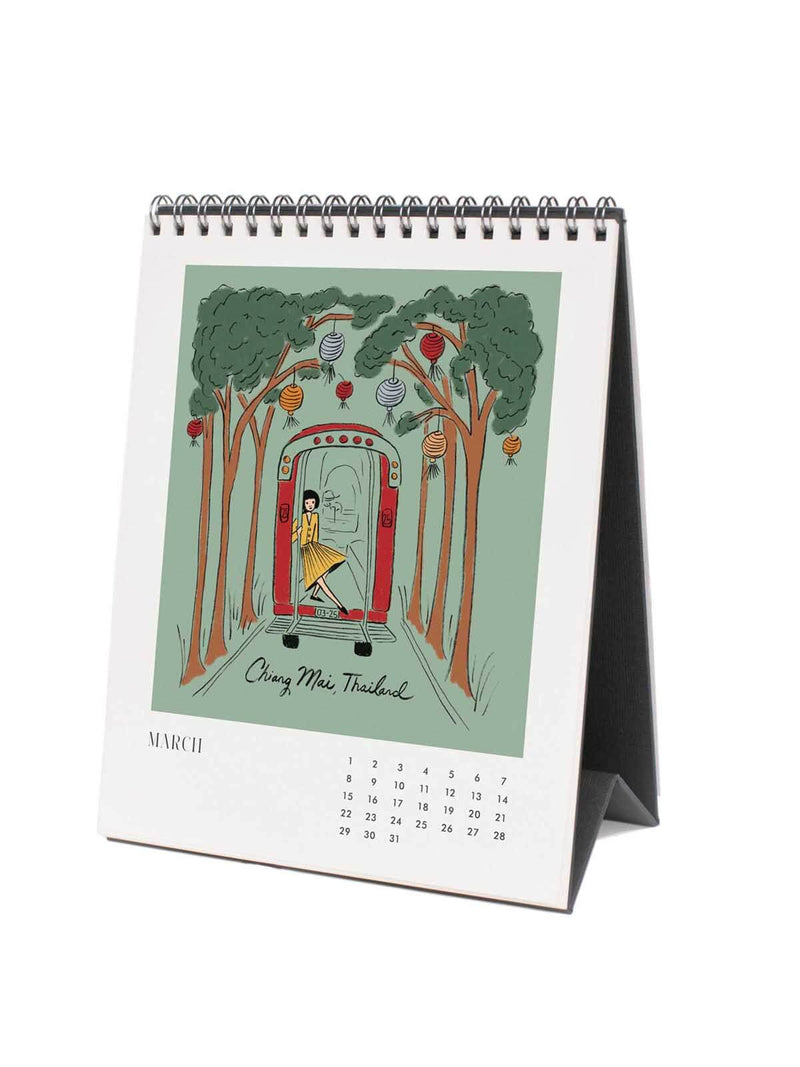 Calendar with illustration of a woman in a dress standing in front of trees with ornaments in Taiwan.