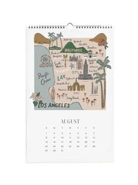 A spiral-bound August Los Angeles desk calendar featuring a colorful illustrated map of Los Angeles on the cover page, with a monthly calendar grid below on a white background.