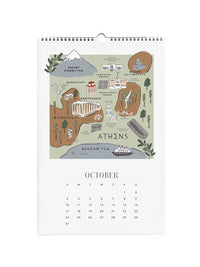 A spiral-bound October wall calendar page featuring an illustrated map of Athens with landmarks and a grid of dates below on a white background.