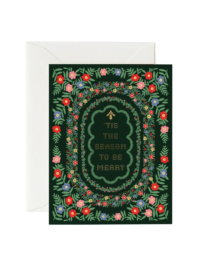 Greeting card with floral border and text 'Tis the season to be merry' on a white background