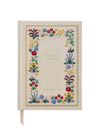 A five-year journal with a cream-colored cover featuring a colorful embroidered floral border and gold scalloped trim. The cover has the text 'FIVE YEAR JOURNAL' in the center, with 'BIBLE PAPER CO.